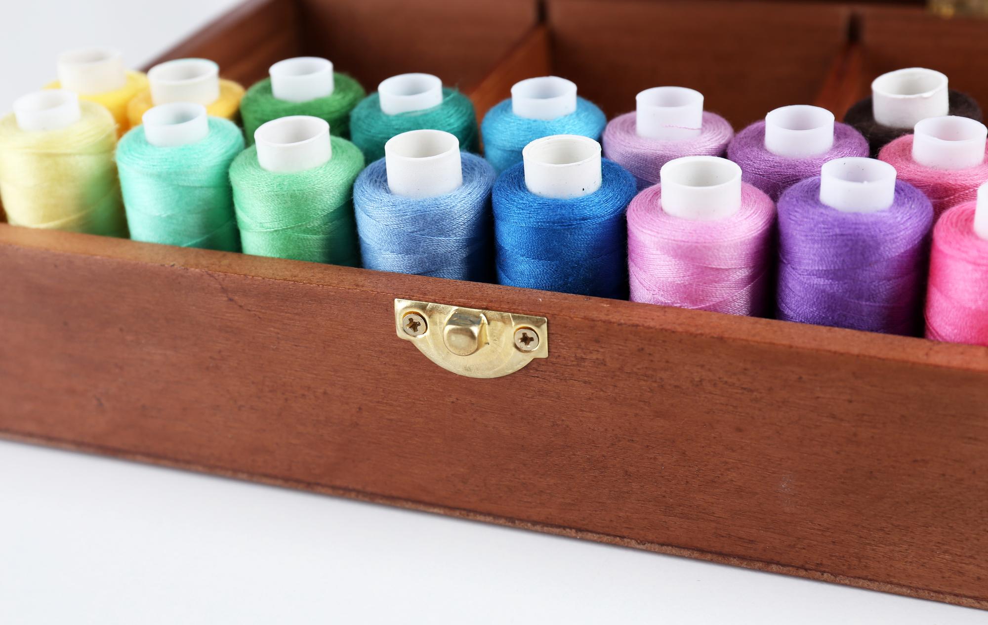 Series of embroidered labels folded on a table